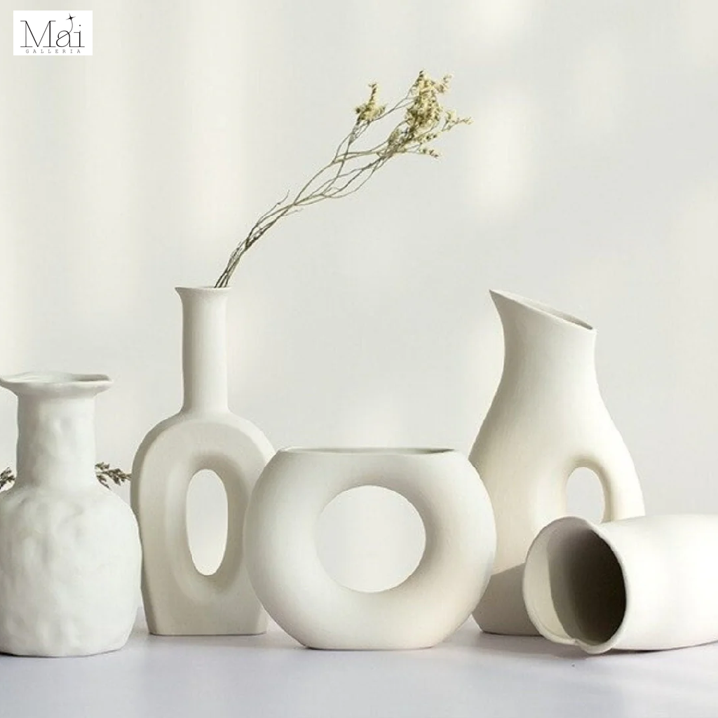 These minimalist white ceramic vases look fantastic individually or as a set These minimalist white ceramic vases look fantastic individually or as a set