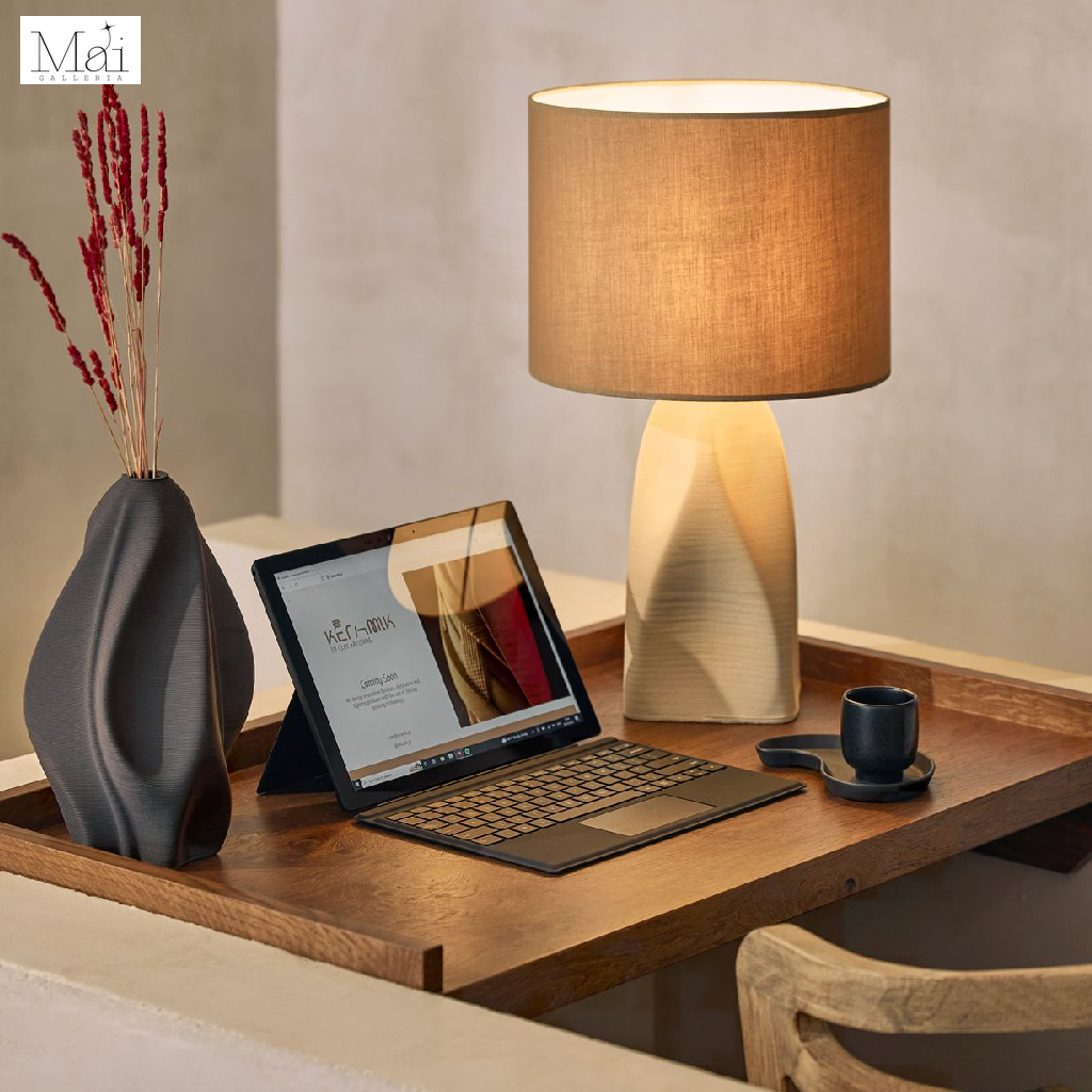 A ceramic table lamp blends utility with elegance A ceramic table lamp blends utility with elegance